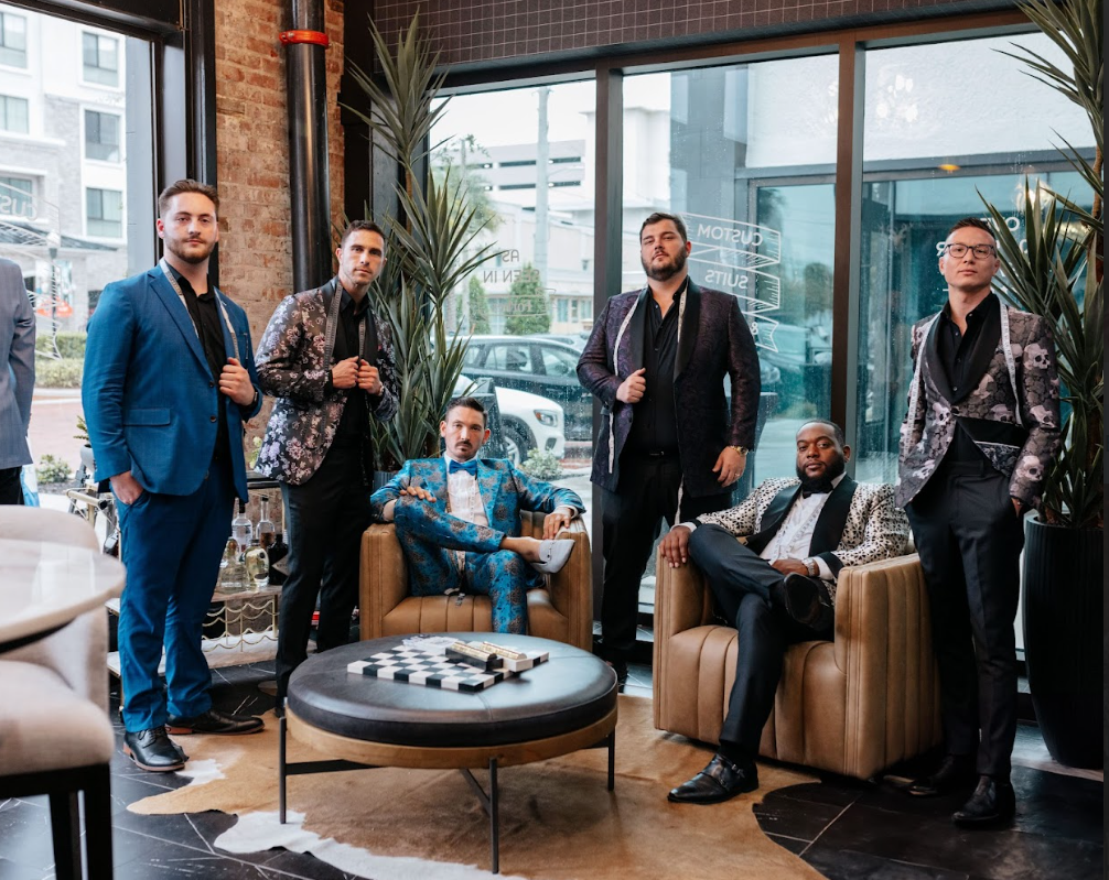 A person proudly wearing attire unique to their culture or subculture, representing the deep psychological connection between clothing, identity, and the need to belong.