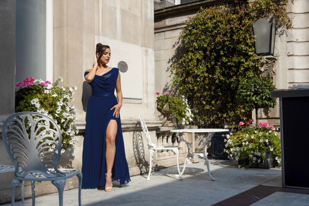 A collage of seasonal wedding guest dresses featuring a floral summer maxi and a long-sleeve velvet winter gown.